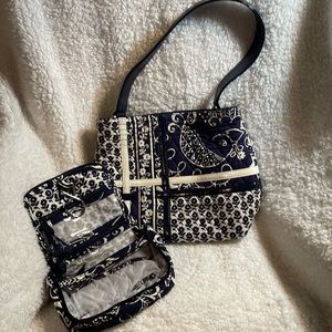 Super cute, vera Bradley set. Includes a little travel bag along with the purse.